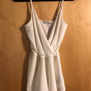URBAN OUTFITTERS ASYMMETRICAL WHITE ROMPER